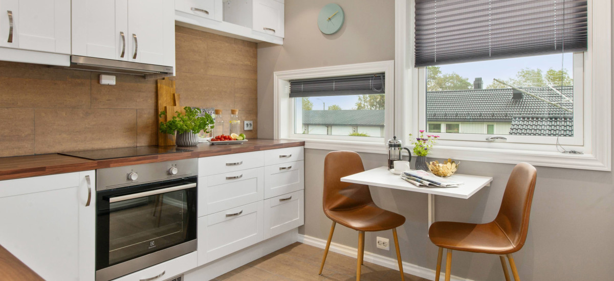 Clean wooden and tiled furnished kitchen