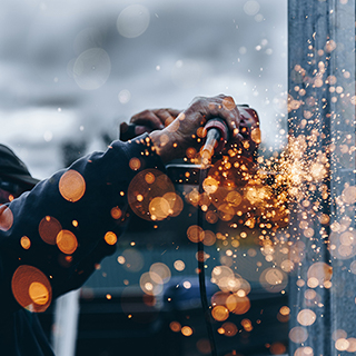 A grinder cutting metal and spraying sparks